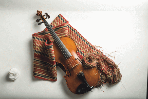 coloured image of fiddle and woven red, black, and brown scarf