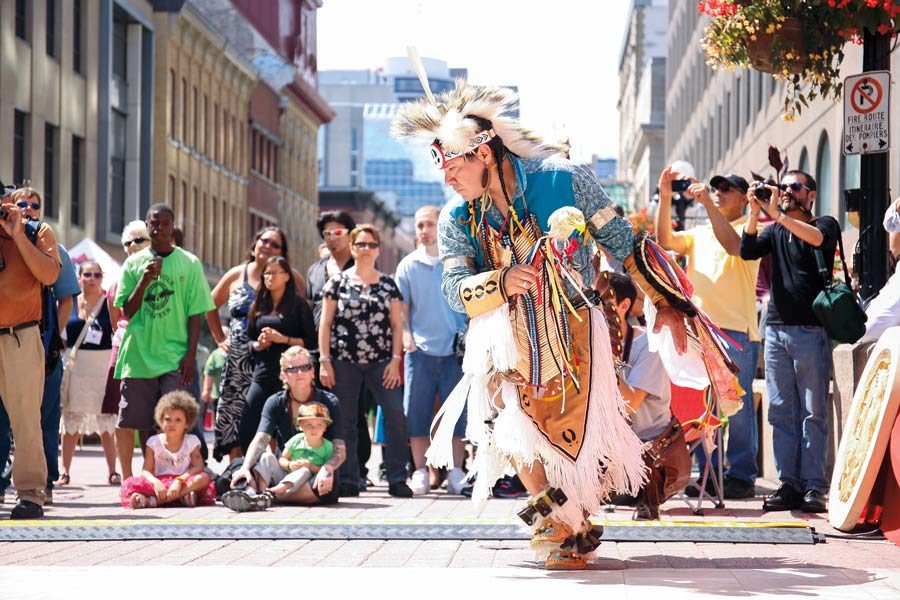 A man dressed in traditional clothing dances in Ottawa