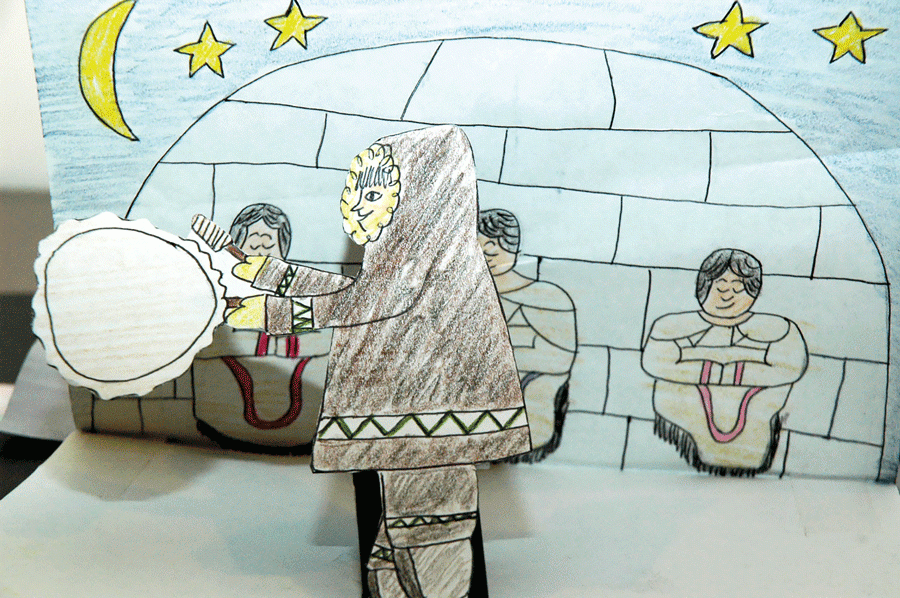 Drawing of an igloo and a person wearing a parka using a drum